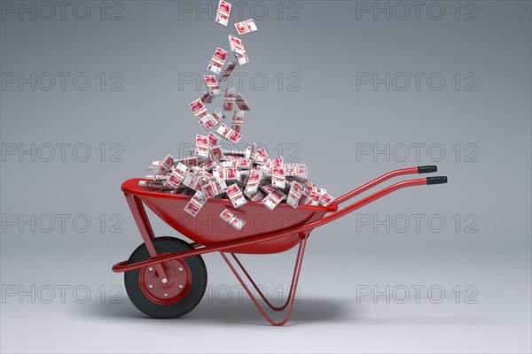Yuan cash falling into red wheelbarrow