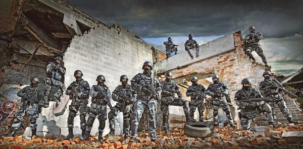 Soldiers wearing masks on ruins in battlefield