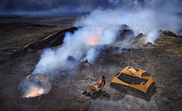 Woman camping with tent on volcano