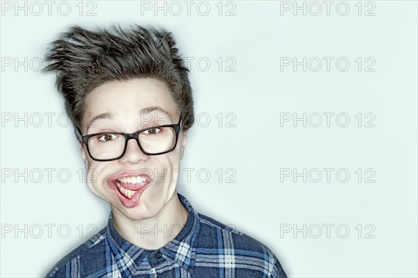 Wind blowing face of Caucasian teenage boy