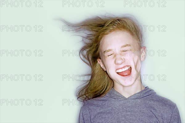 Wind blowing face of Caucasian girl