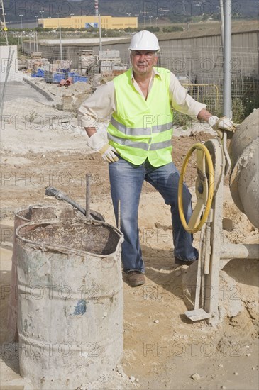 Hispanic construction worker standing on construction site