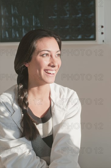 Smiling Hispanic doctor in hospital