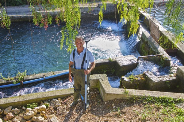 Hispanic fisherman holding net