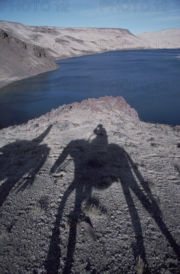 Argentina Mendoza Province The Andes shadow of people on horseback