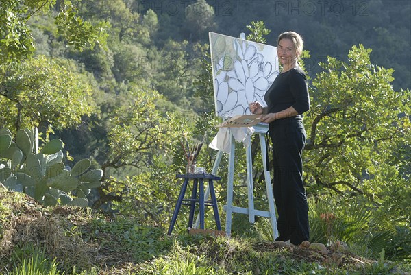 Woman with canvas smiling portrait