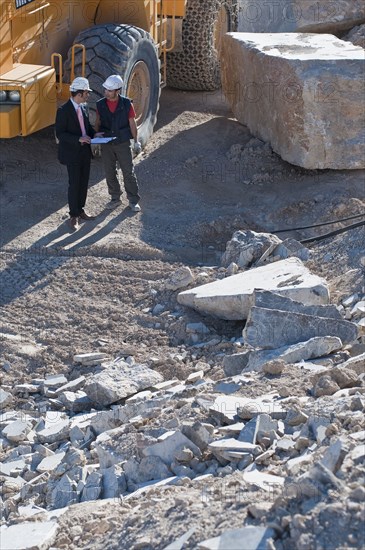 manager and worker in marble quarry