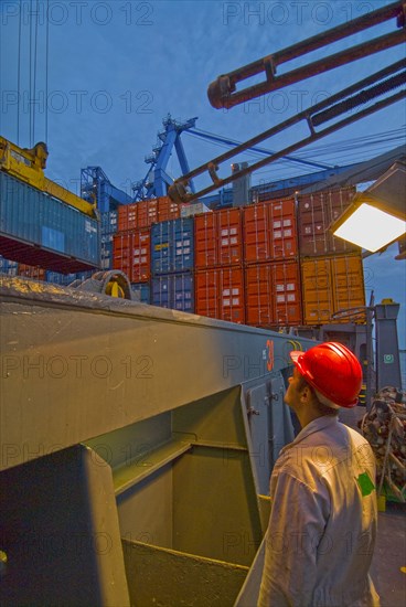 seaman watching container being loaded