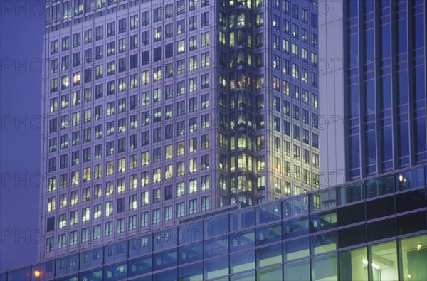 High rise office building illuminated at dusk