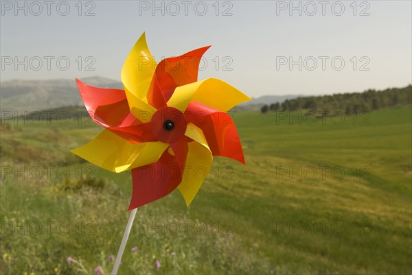 wind wheel over green fields