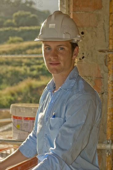 Young man wearing hardhat portrait