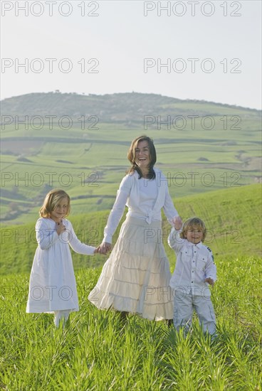 happy family in green fields