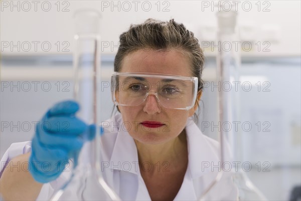 Mature woman in laboratory