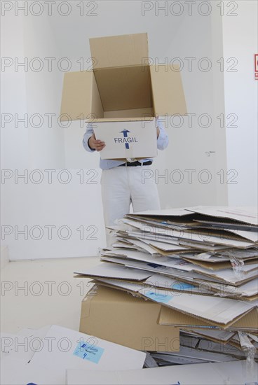 Man holding empty cardboard box