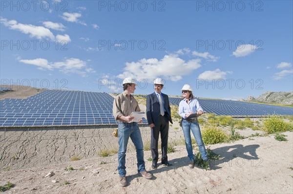 engineers and businessman in solar plant