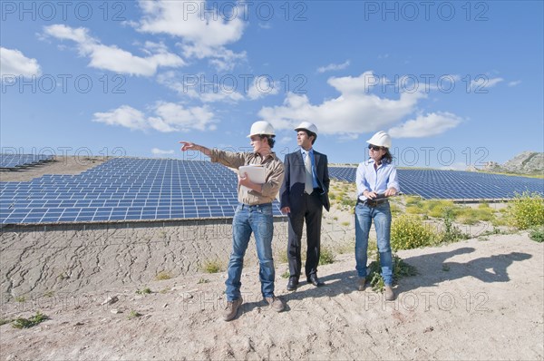 engineers and businessman in solar plant
