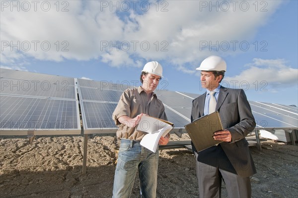 engineer and businessman in solar plant