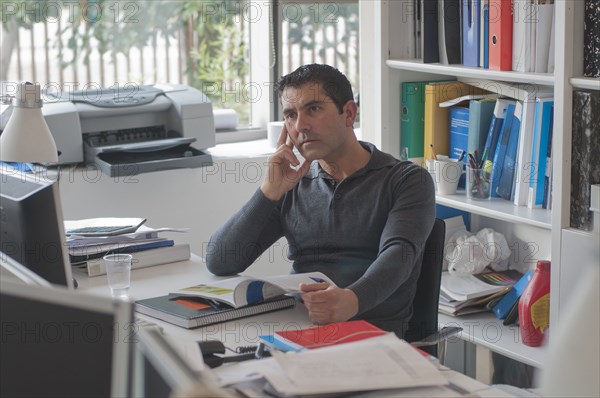 tired office worker staring at computer screen