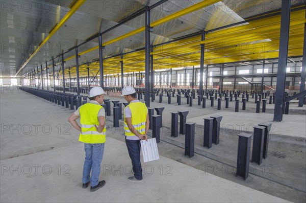 Workers talking in warehouse