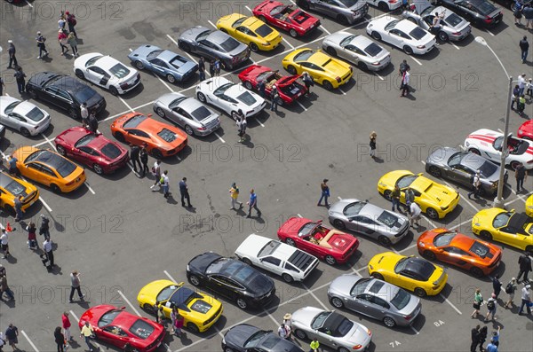 Aerial view of people walking in parking lot