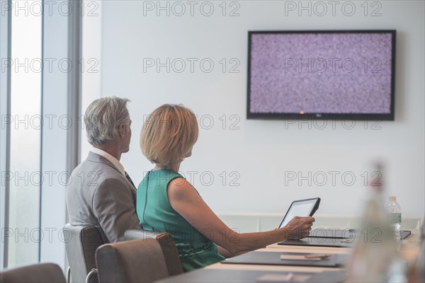 Caucasian business people in videoconference meeting