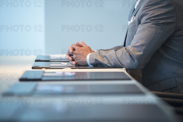 Caucasian businessman sitting at conference table