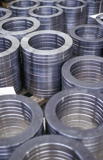 High angle view of stacked metal coils in factory