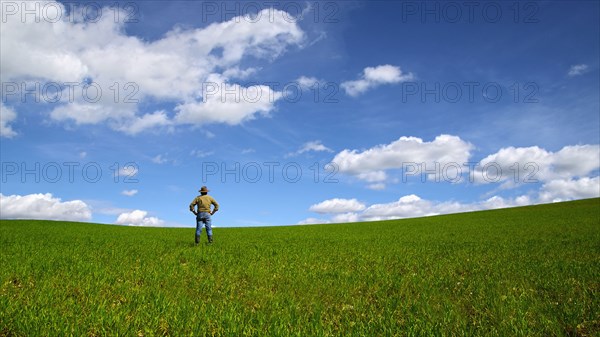 Caucasian man standing in rural field