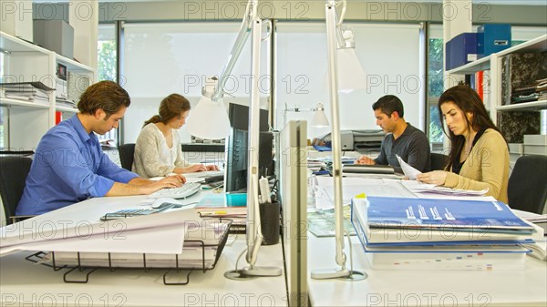 Business people working at desk in office