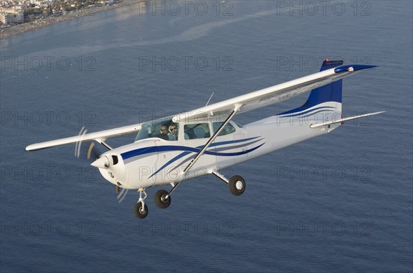 Aerial view of airplane flying over ocean