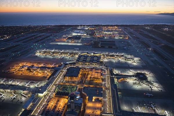 Aerial view of airplanes parked in airport gates