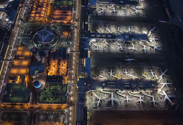 Aerial view of airplanes parked in airport gates