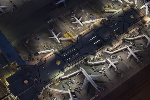 Aerial view of airplanes parked in airport gates