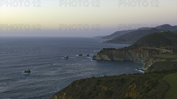 Scenic view of cliffs at ocean