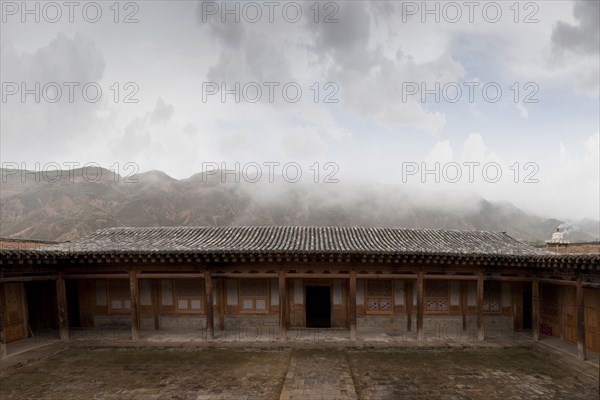 Remote monastery and cloudy sky