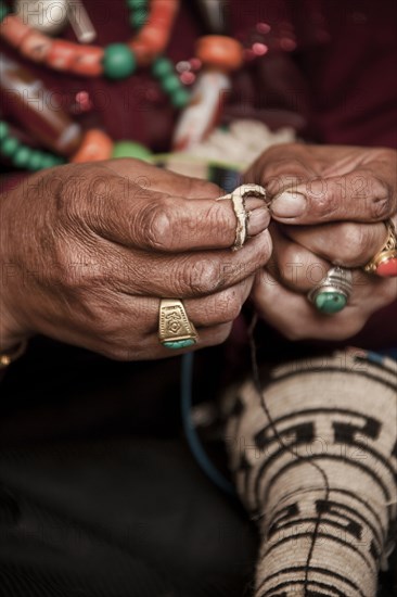 Close up of artist making traditional jewelry