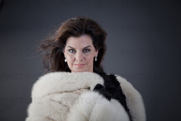 Caucasian woman wearing fur coat