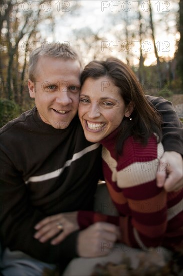 Smiling couple hugging outdoors