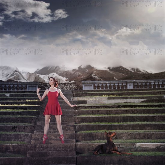 Caucasian ballet dancer balancing on ruins