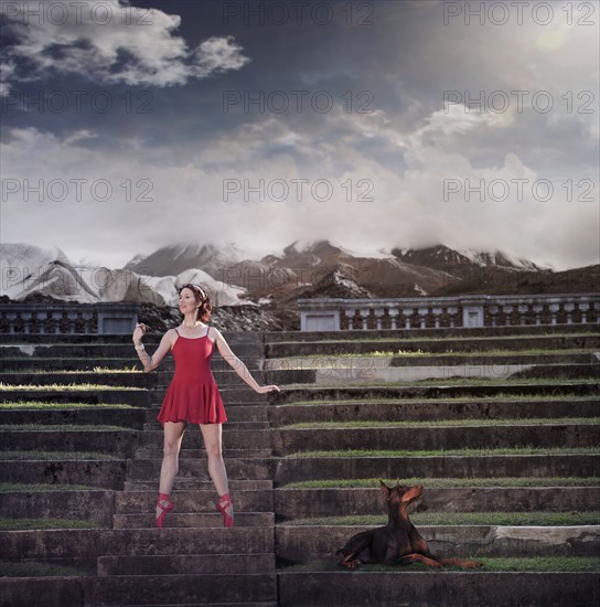 Caucasian ballet dancer balancing on ruins