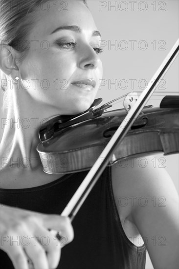 Caucasian musician playing violin