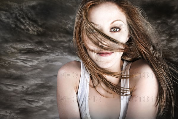 Hair of Caucasian woman blowing in storm wind
