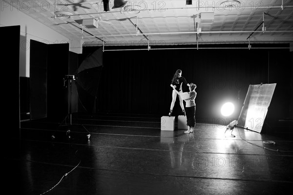 Caucasian ballet dancers practicing on stage