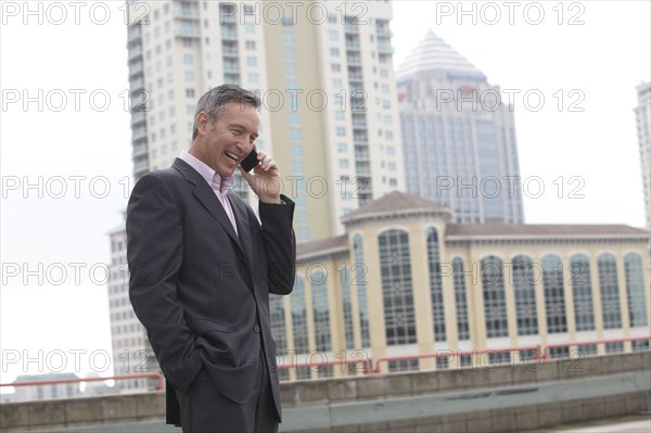 Caucasian businessman talking on cell phone