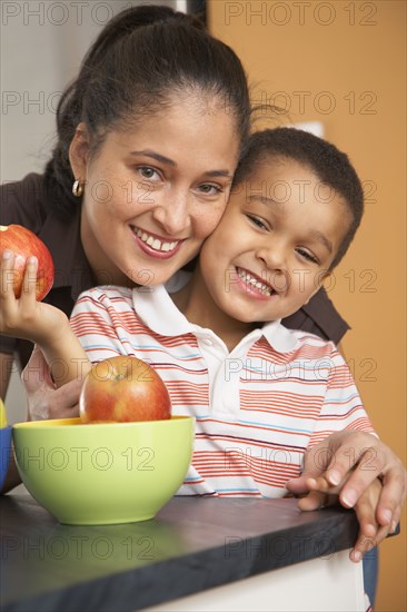 Dominican mother hugging son