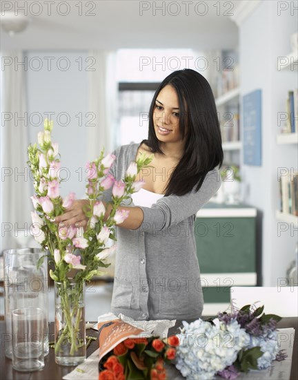 Woman arranging flowers