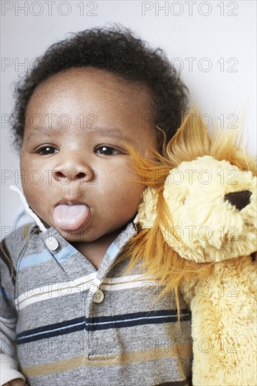 African American baby sticking out tongue