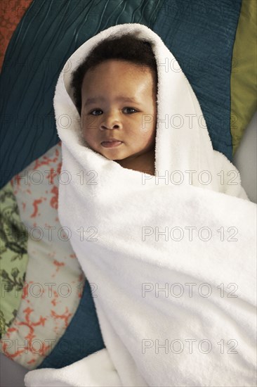 African American baby wrapped in towel