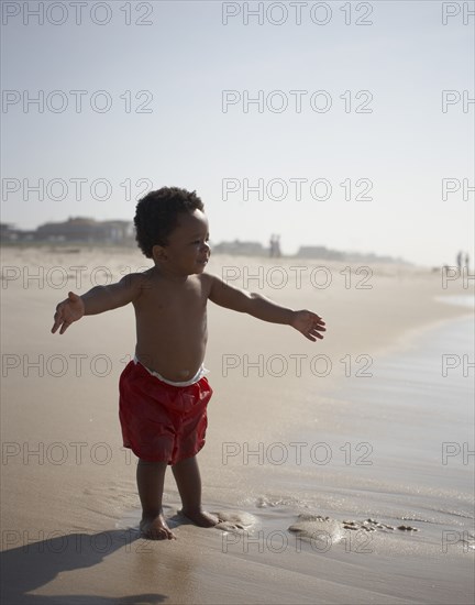 African American baby boy enjoying beach