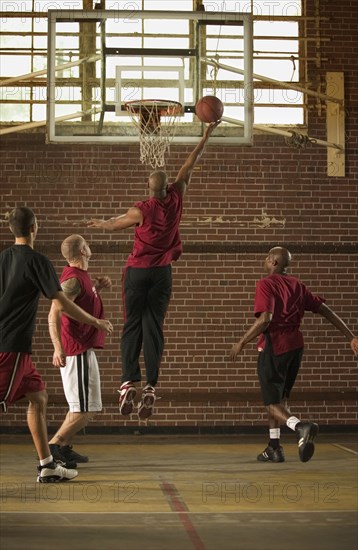 Men playing basketball